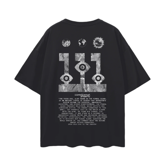 Black short-sleeved drop shoulder t-shirt with graphic print in the center featuring abstract designs about pineal gland